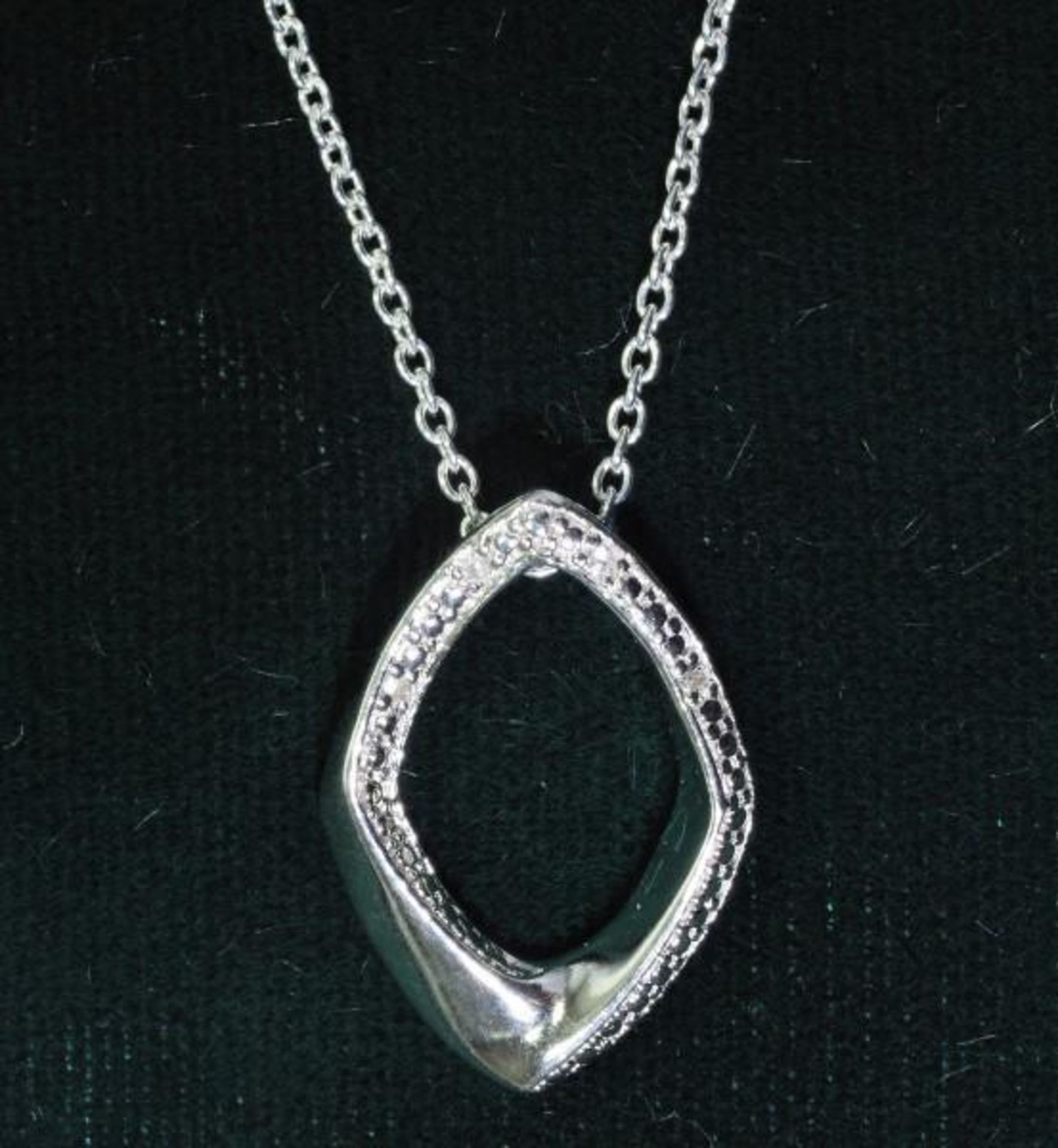S. Silver Diamond Pendant with Chain. Retail $120 (MS07 - 16)