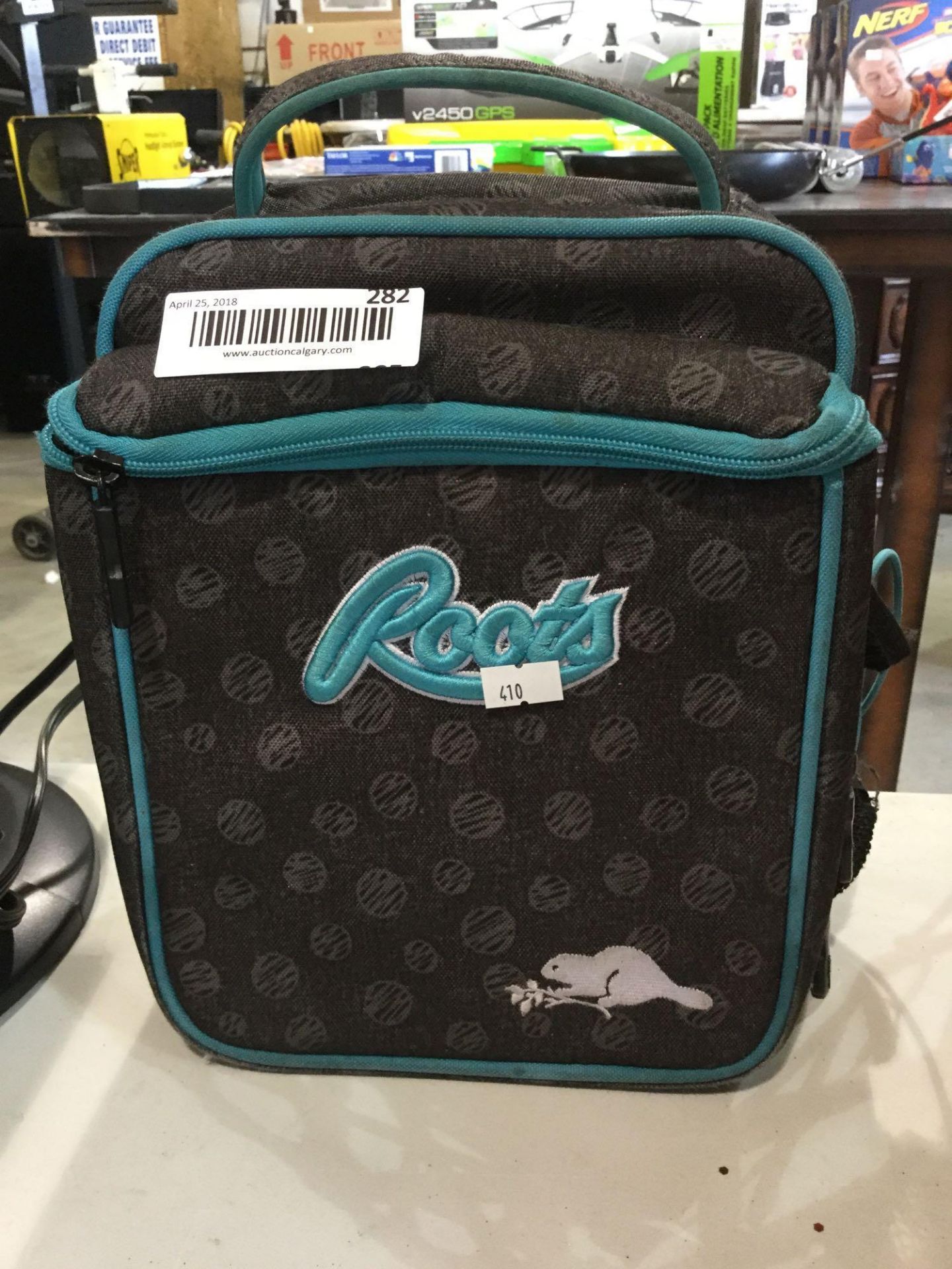 roots kids back pack grey and teal in colour