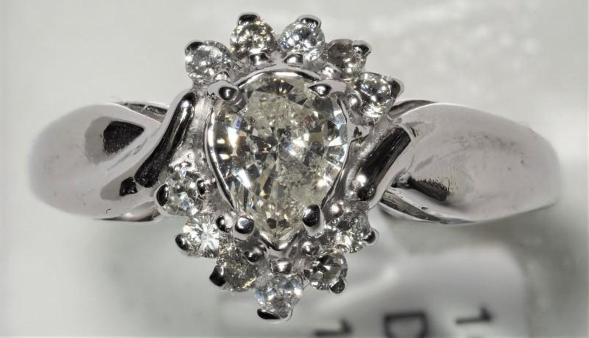 10K White Gold Pear Diamond (0.44ct, April Birthstone) with 11 Accompanying Diamonds (0.11ct) Ring. - Image 2 of 4