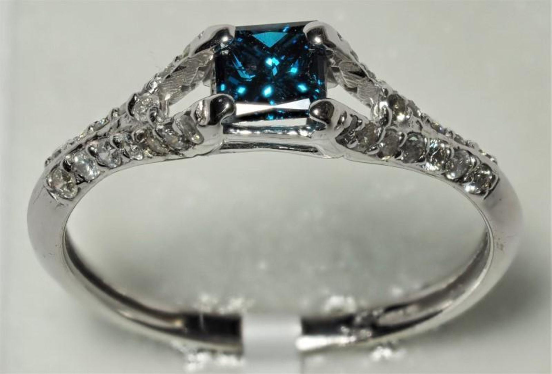 14K White Gold Blue (0.47ct) Princess Cut With Accompanying White Diamonds (0.30ct) Ring. Insurance