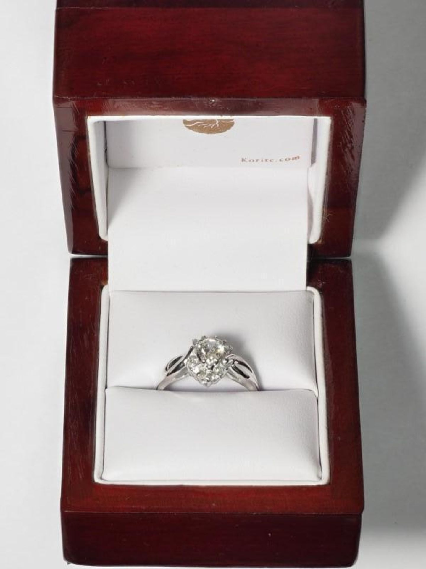 10K White Gold Pear Diamond (0.44ct, April Birthstone) with 11 Accompanying Diamonds (0.11ct) Ring. - Image 3 of 4