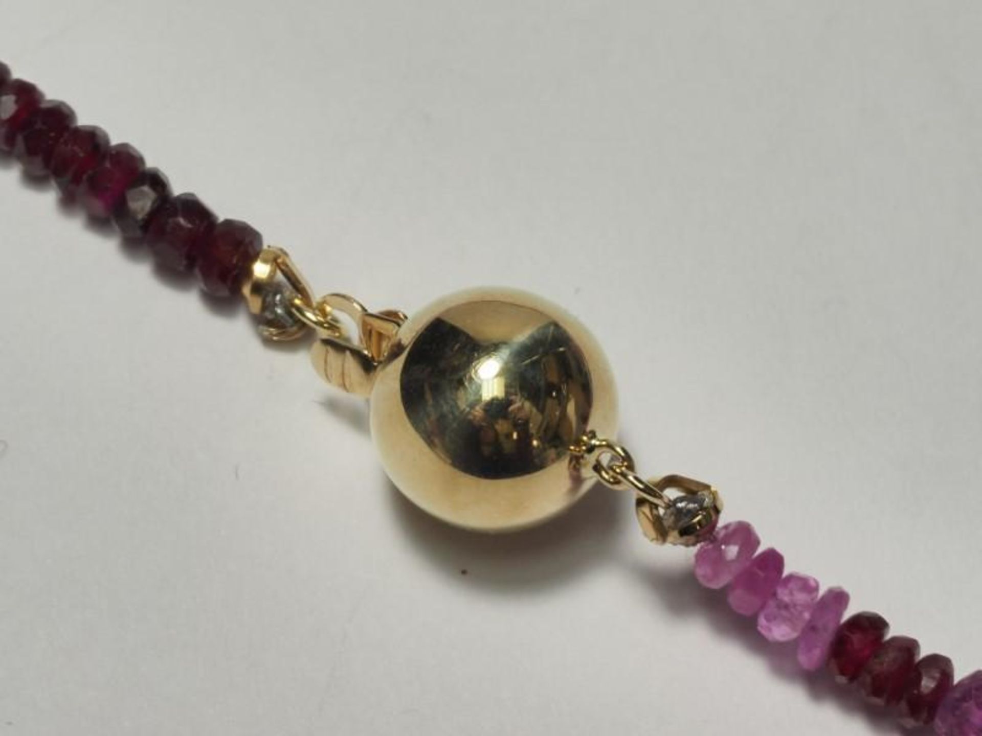 14K Yellow Gold Ruby and Sapphire (45.0ct) Graduated Colour Bead 16" Necklace. Retail Appraised Valu - Image 2 of 4