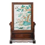 A fine Chinese hardwood table screen, the famille rose plaque decorated with horses, deers,