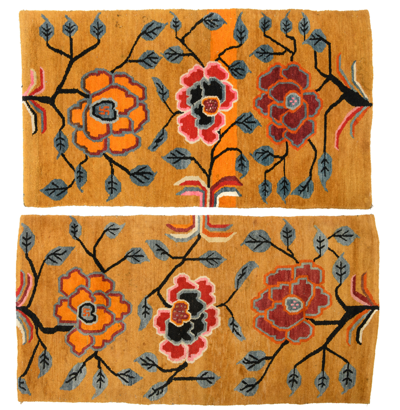 A pair of Sino-Tibetan carpets, wool on cotton, with styled floral motifs, 63 x 85 and 66 x 88 cm