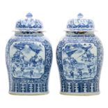 A pair of impressive Chinese celadon ground blue and white decorated vases and covers with lotus