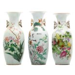 Three Chinese famille rose vases, decorated with flower branches, fruits, cranes and calligraphic