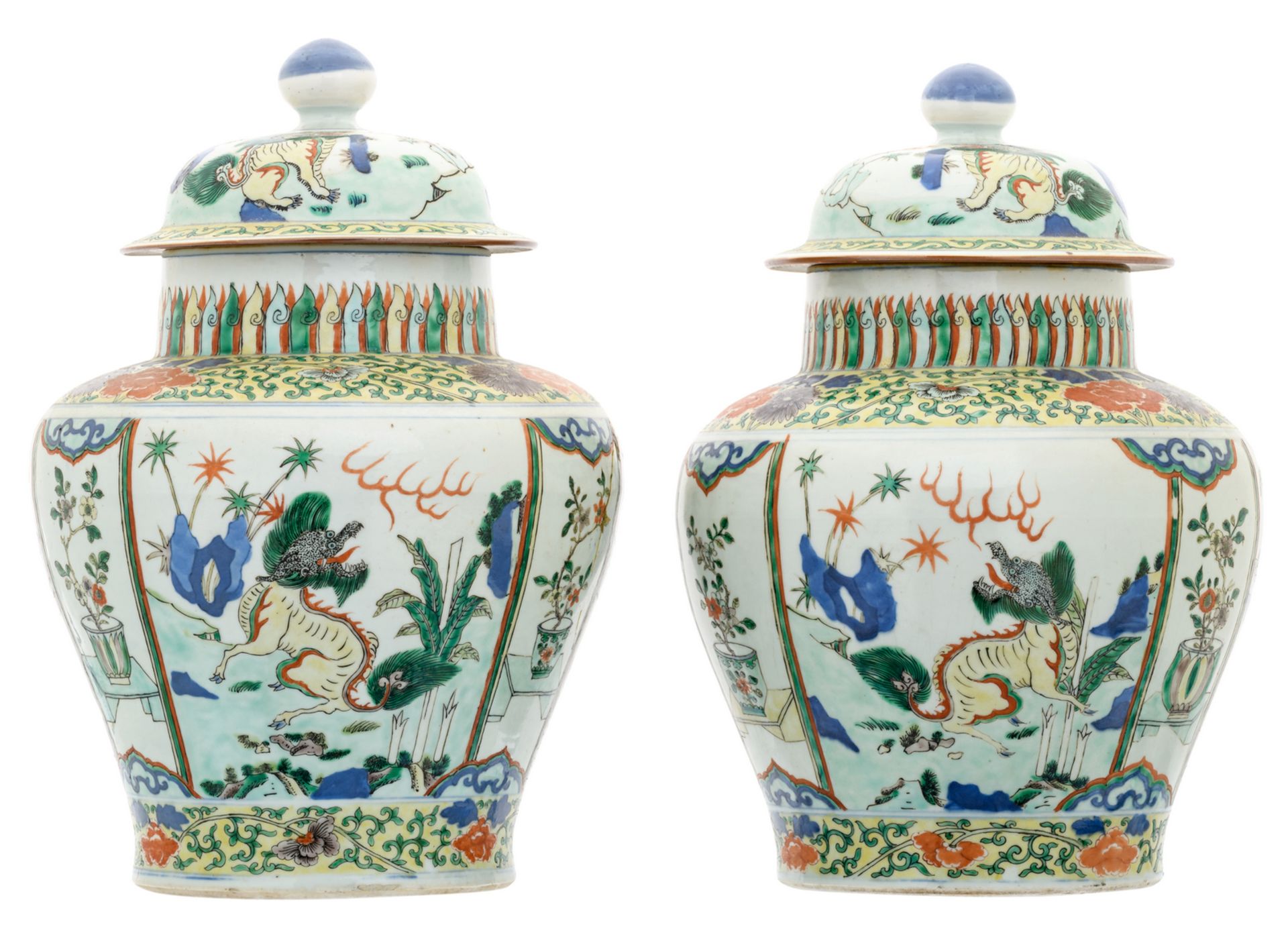 A pair of Chinese wucai overall floral decorated vases and covers with Fu lions, 17th/18thC, H 37,