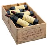 Twelve bottles Saint-Estèphe 'Château Beauséjour', 1986, in a wooden box