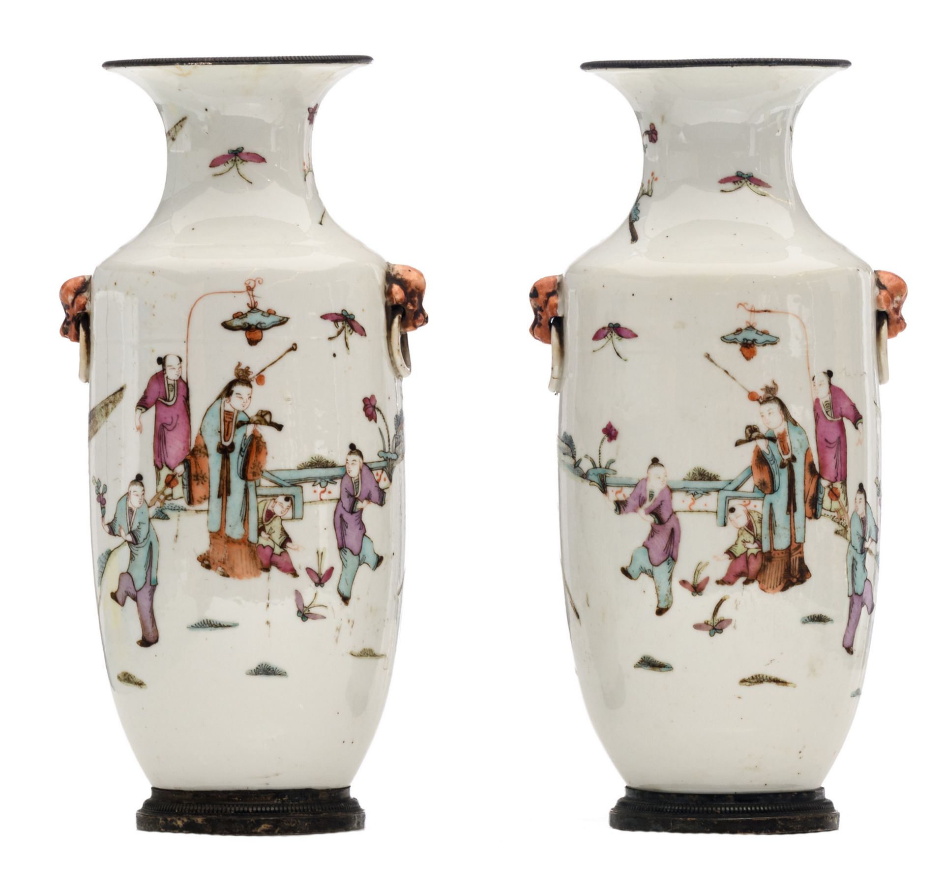 A pair of Chinese famille rose vases, overall decorated with an animated scene, with silver