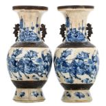 Two Chinese baluster shaped stoneware vases, blue and white decorated with warriors, marked, about