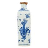 A Chinese blue and white cylindrical vase, overall decorated with flower vases and rocks,