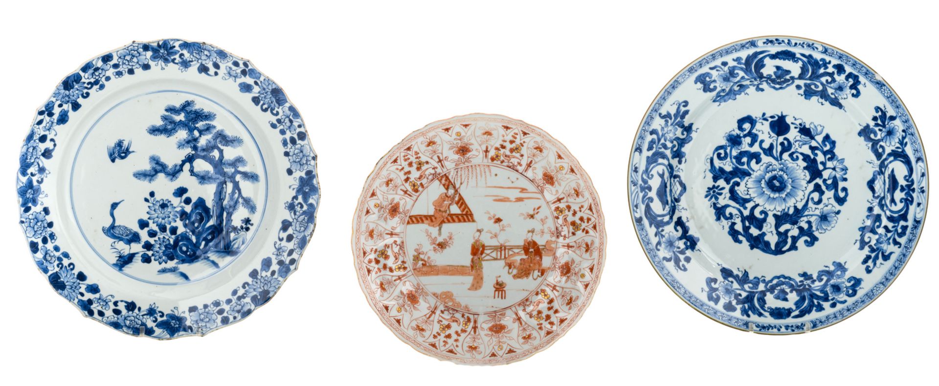 Two Chinese blue and white floral decorated plates, 18thC; added a Chinese iron red and gilt