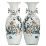 A pair of Chinese polychrome decorated vases with ladies, cranes and a deer in a garden and