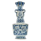 A fine Chinese blue and white floral decorated 'arrow vase' on a quadrangular base, the roundels