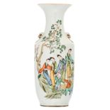 A Chinese polychrome decorated vase with ladies and playing children in a garden and calligraphic