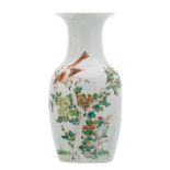 A Chinese polychrome decorated vase with a bird on a flower branch, H 44 cm