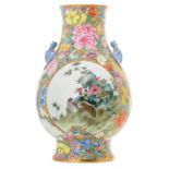 A fine Chinese millefleurs and famille rose vase, the roundels decorated with birds, rocks and