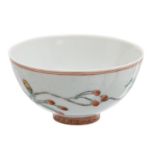 A Chinese polychrome decorated cup with butterflies and a flower branch, Kangxi marked, H 4 - ø 7,