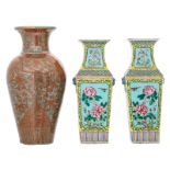 A pair of Chinese turquoise ground famille rose quandrangular vases, the roundels decorated with