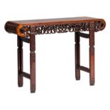 A Chinese carved hardwood side table with open work lotus and funghi decoration, H 83,5 - W 120 -