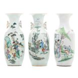 Three Chinese polychrome decorated vases with various garden scenes and calligraphic texts, H 58 cm