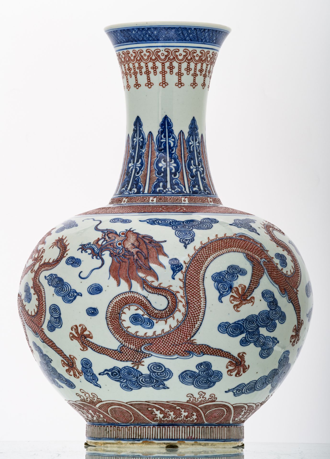 A Chinese cobalt blue underglazed and copperred glazed dragons amongst clouds decorated vase with - Image 3 of 6