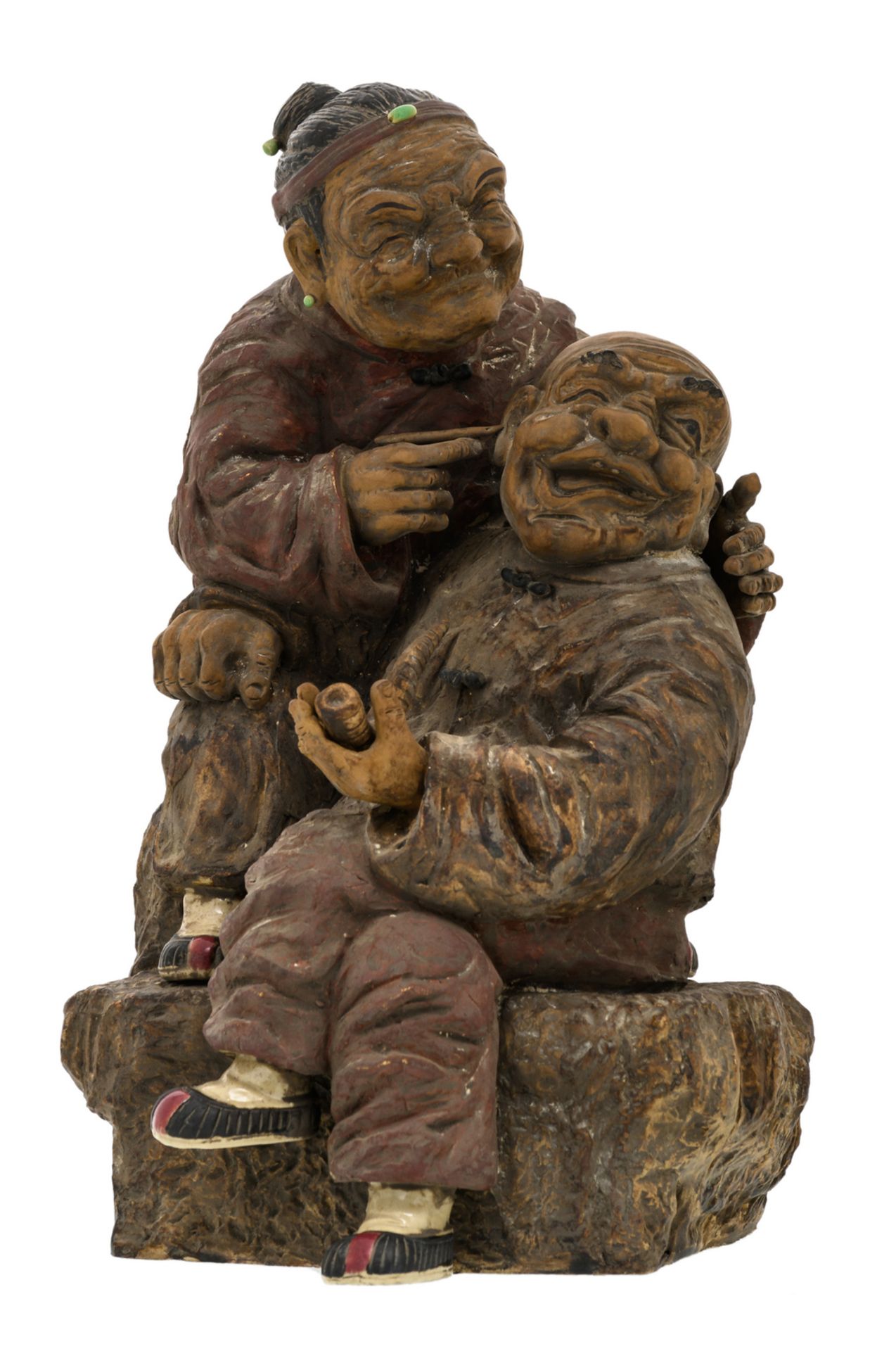 A Chinese polychrome stoneware partially glazed group depicting two amused elderly people, marked, H