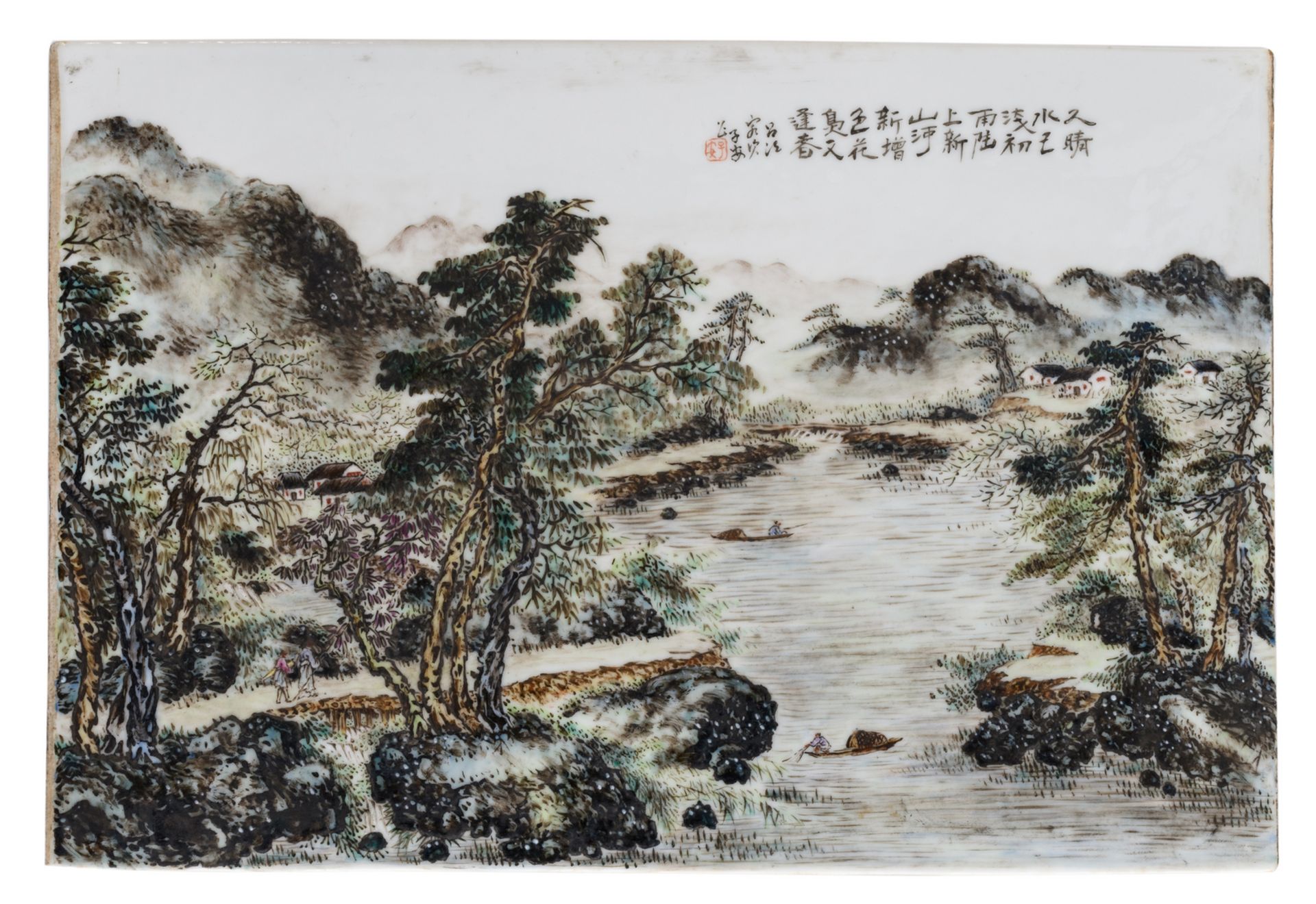 A Chinese polychrome decorated plaque with figures and boats in a mountainous river landscape,