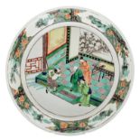 A Chinese famille verte plate decorated with an animated scene, marked, ø 35 cm