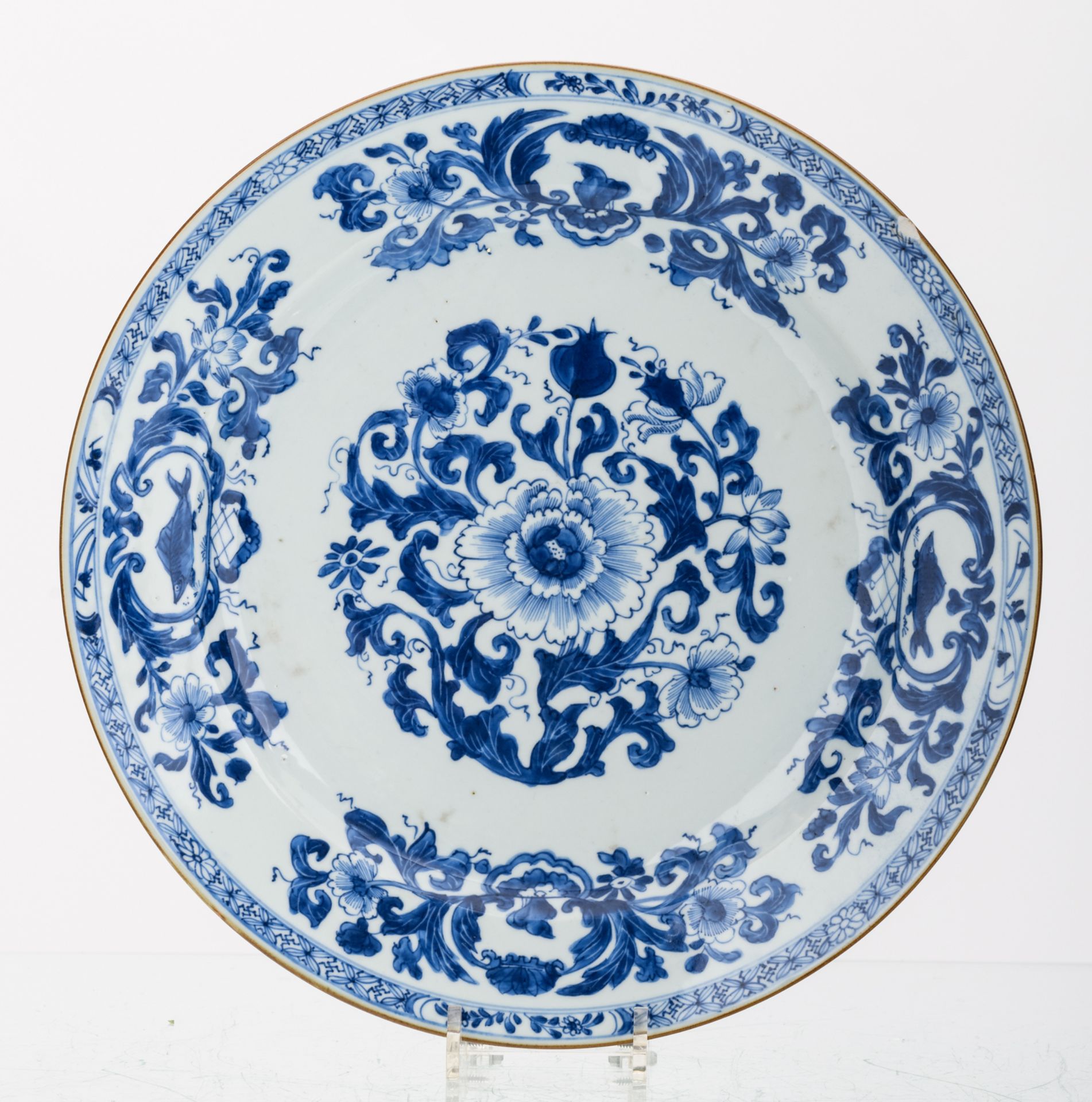 Two Chinese blue and white floral decorated plates, 18thC; added a Chinese iron red and gilt - Image 2 of 4