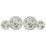 Two Chinese famille rose export porcelain plates, decorated with flower branches and two ditto
