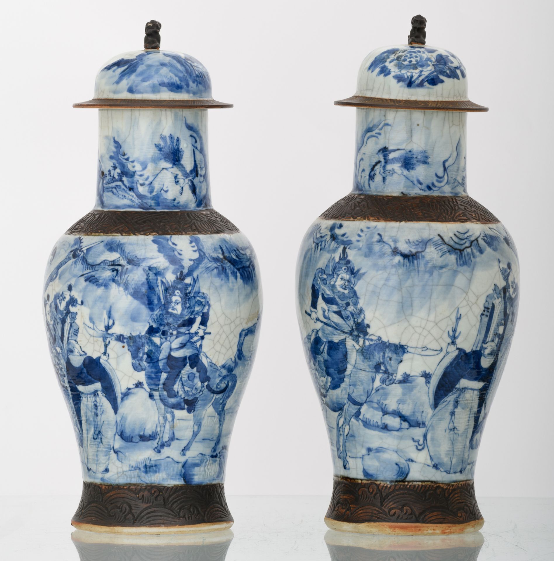 Two Chinese stoneware blue and white decorated crackleware vases and covers with deities in a - Image 4 of 6