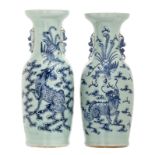 Two Chinese celadon ground blue and white vases, decorated with a phoenix and a Fu lion, 19thC, H 60