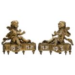 A pair of bronze andirons depicting a warming angel couple, H 30,5 - W 30,5 cm