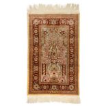 An Oriental silk and silver thread woven carpet, 43,5 x 68,5 cm