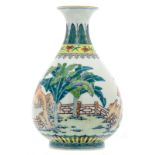 A Chinese doucai overall decorated pear shaped vase with various plants amid rockwork in the garden,