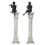 A pair of cast iron music making satyrs on a white and gray marble pedestal, H 135,5 cm