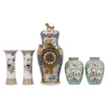 A pair of Chinese turquoise ground famille rose floral decorated ginger jars and covers, the