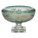 A decorative green overlay Val-Saint-Lambert crystal cut bowl on foot, acid-bitten frieze and relief