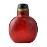 A Chinese ruby red crackled glass snuff bottle with bronze mounted tiger eye knob, H 8 cm