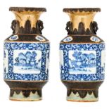 A pair of Chinese blue and white and relief decorated stoneware vases, the roundels with flower