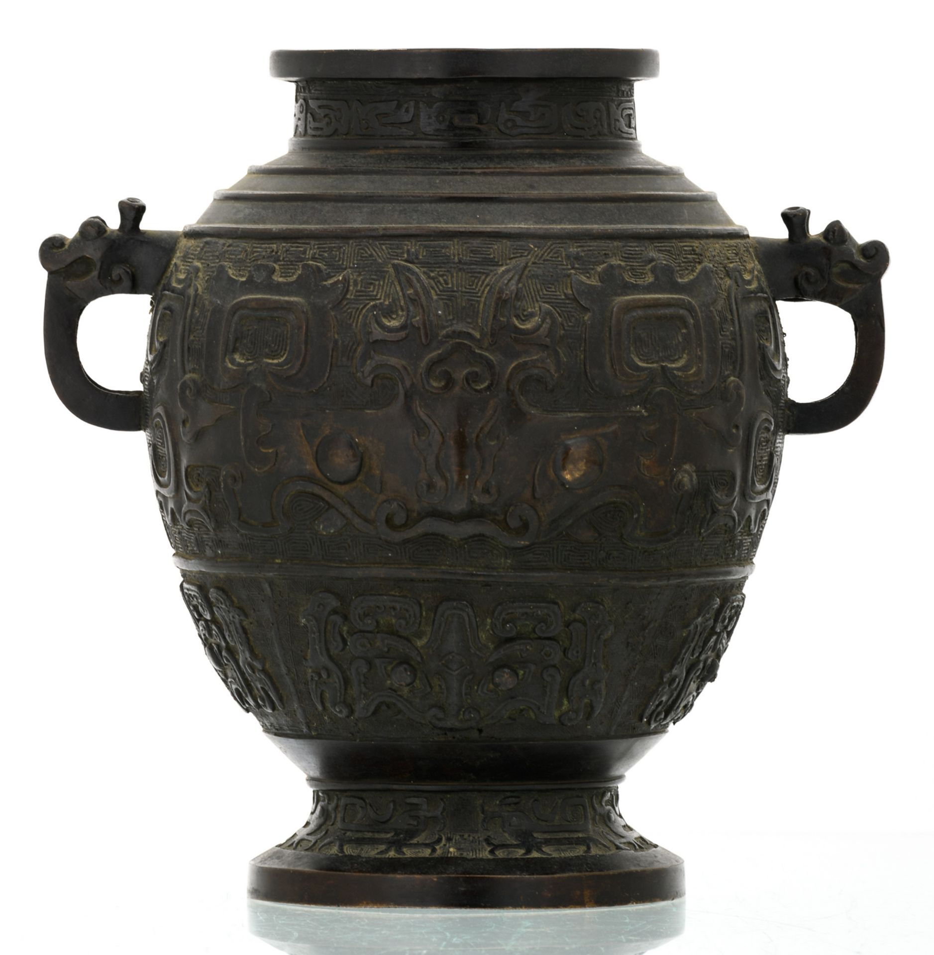A Chinese bronze archaic vessel, relief decorated with taoti, the handles dragon shaped, about 1900, - Image 3 of 6