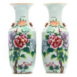 A pair of Chinese famille rose vases, decorated with peonies and calligraphic texts, marked, H 57