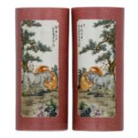 A pair of Chinese pink ground floral incised cylindrical vases, the roundels polychrome decorated