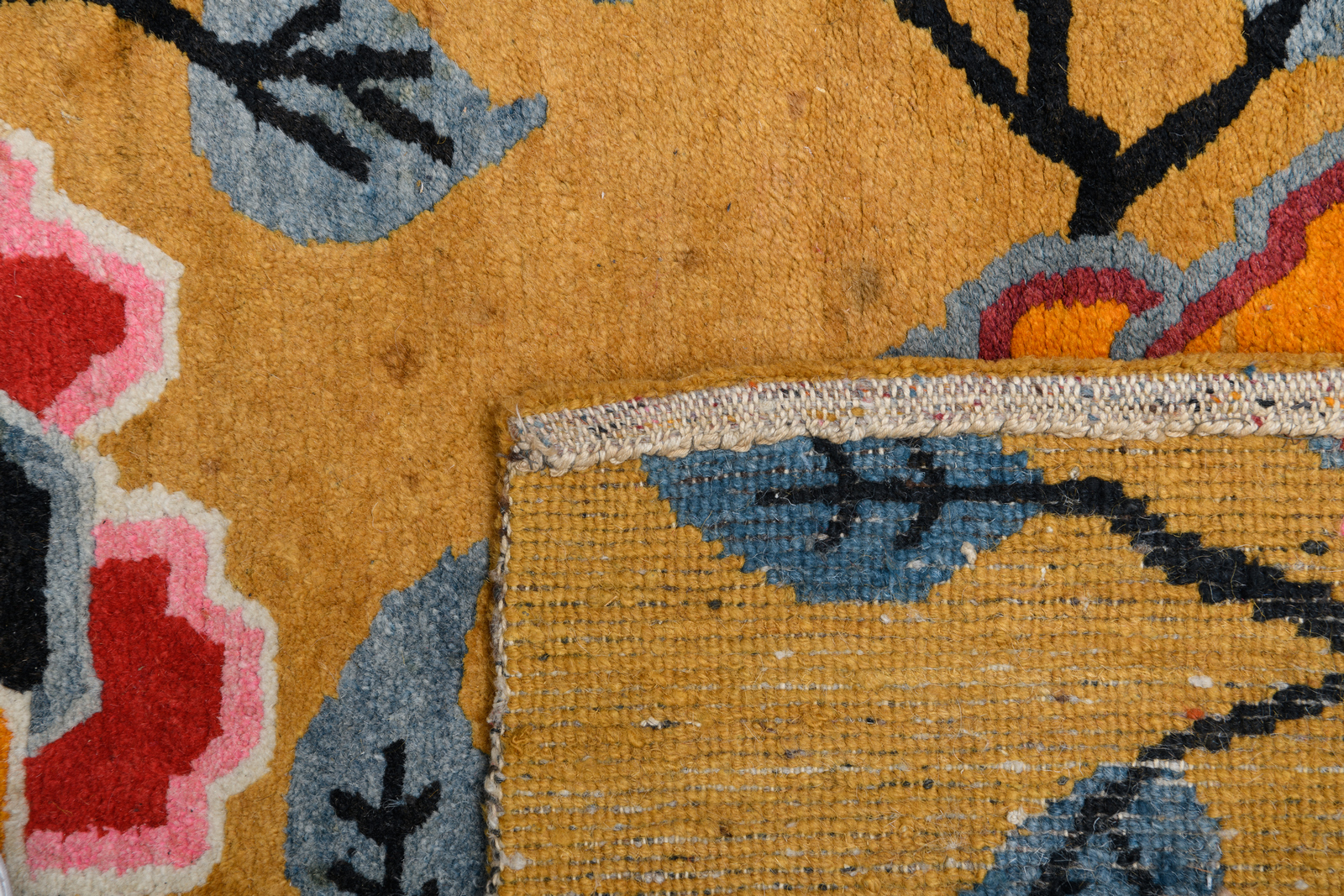 A pair of Sino-Tibetan carpets, wool on cotton, with styled floral motifs, 63 x 85 and 66 x 88 cm - Image 3 of 4