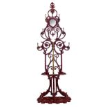 A red lacquered cast iron coat rack, H 195 - W 66 - D 35 cm