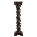 An early 20thC oak Baroque revival pedestal, H 157 cm