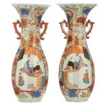 A pair of Japanese polychrome floral and dragon relief decorated vases, the roundels with figures,