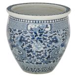 A Chinese blue and white jardiniere decorated with dragons and flower branches , 19thC, H 40 - ø