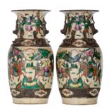 A pair of Chinese stoneware vases, overall polychrome decorated with warriors, marked, about 1900, H